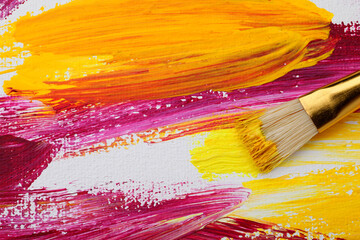 Painting with colorful oil paints on white canvas, closeup view