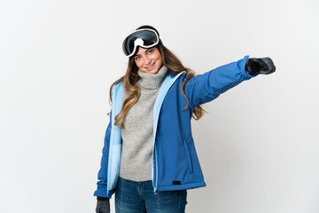 Skier girl with snowboarding glasses isolated on white background giving a thumbs up gesture