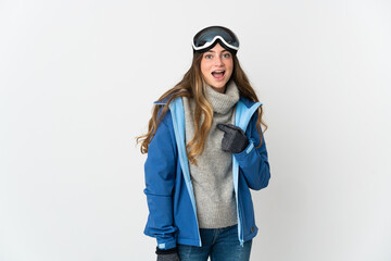 Skier girl with snowboarding glasses isolated on white background with surprise facial expression