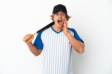 Young blonde man playing baseball isolated on white background with surprise and shocked facial expression