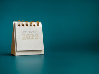 Happy new year 2023 background. Happy New Year, text and 2023 numbers year on small desk calendar...