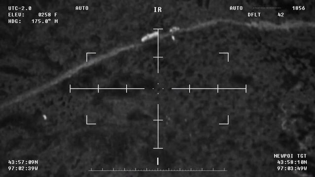 Military is using modern drone software to locate the target for a rocket attack. Military drone is scouting the area for rocket attack. Military drone is shooting a rocket at the enemy vehicles. UI.