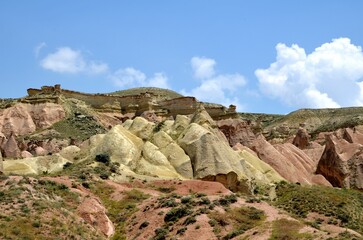 colorful rock formation with plants and meadows in Cappadocia, turkey