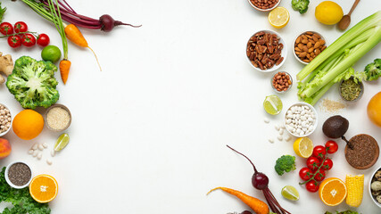 White cooking background with set fresh vegetables top view  roots grains nuts