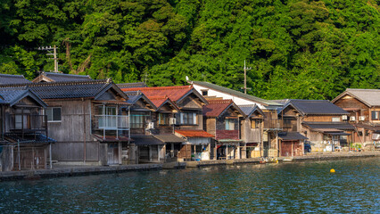 Fototapeta na wymiar Lined up boathouses at Ine Town in Kyoto, Japan.
