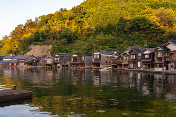 Fototapeta na wymiar Lined up boathouses at Ine Town in Kyoto, Japan.