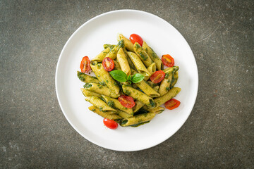 penne pasta with pesto sauce and tomatoes