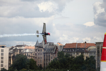 Light Sport Aircraft flies  over the  city