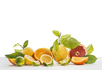Group of various citrus fruits on white table, isolated  at transparent background. 