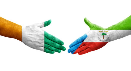 Handshake between Equatorial Guinea and Ivory Coast flags painted on hands, isolated transparent image.