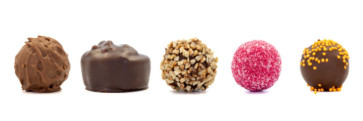 Chocolate praline. Assorted chocolates isolated on a white background. close up