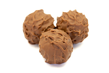 Chocolate praline. Milk chocolate isolated on white background. close up