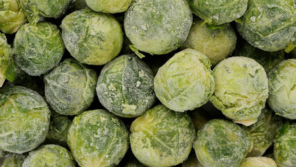 Fototapeta na wymiar Frozen Brussels sprout top view. Healthy vegan food concept