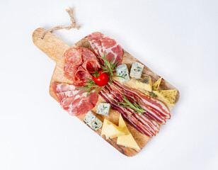 Mixed delicatessen with charcuterie and cheese board with a place for text. Italian appetizers or...