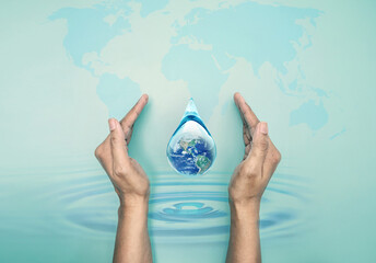 Hand hold world in clean water drop on and fresh blue water ripples design, Environment save and ecology theme and world water day concept, the Elements of this image furnished by NASA