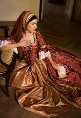 Lady in medieval dress and letter - obrazy, fototapety, plakaty