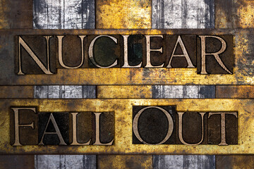 Nuclear Fall Out text with on vintage textured grunge copper silver and gold background