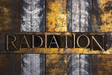 Radiation text with on vintage textured grunge copper silver and gold background