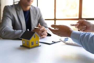 Business people negotiating a contract, Close up Businessmen or Real Estate agents explain signing...