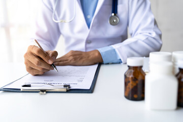 The doctor has written a prescription. and treatment details Medicines used for patients.