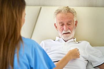 Home healthcare service , Nurse check parient hart by stethoscope in bed room