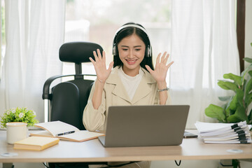 Asian woman working with customers in office
