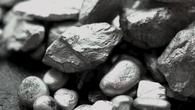 lump of silver or platinum or rare earth mineral on a floor	