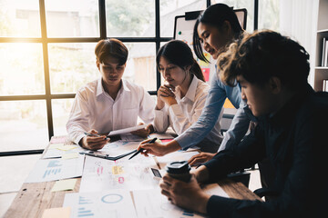 close-up of Business team point data the business plan, discussing analysis with financial data and marketing growth report graph in team.