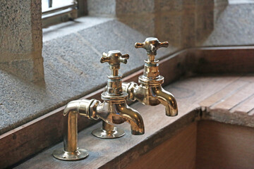 Copper taps by a vintage sink