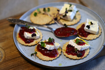 Canape with jam and brie cheese. Healthy snack.