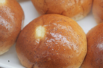 close up of stack of baked bread on table 