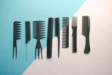 overhead view of Professional combs on color background 