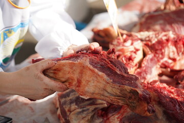 Large pieces of beef on sale at the market.