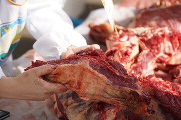 Large pieces of beef on sale at the market.