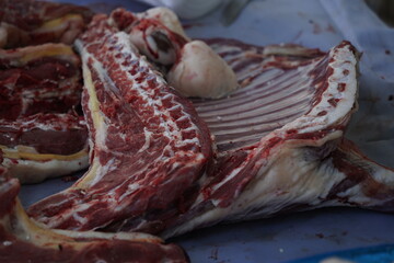 Large pieces of beef on sale at the market.
