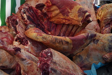 Large pieces of beef on sale at the market.