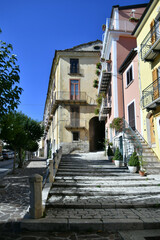 A narrow street between the old stone houses of Frosolone, a medieval village in the Molise region of Italy.