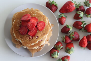 ancakes. Soft and fluffy Buttermilk pancakes with fresh strawberries made with fresh cut...