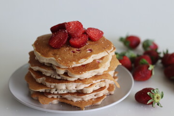 ancakes. Soft and fluffy Buttermilk pancakes with fresh strawberries made with fresh cut strawberries added to the batter made of flour, buttermilk and eggs