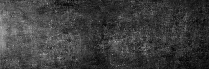 Fototapeta na wymiar Blank wide screen Real chalkboard background texture in college concept for back to school panoramic wallpaper for black friday white chalk text draw graphic. Empty surreal room wall blackboard pale.