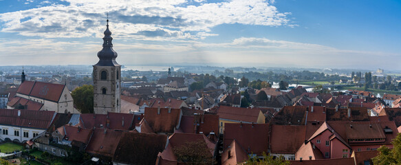 cityscape panorama of the rooftops and streets of Ptuj as seen from the Ptuj Castle hilltop