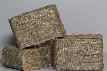 Wood chips, sawdust un flax pressed briquettes for heating. Solid fuel, briquettes, can be used as...