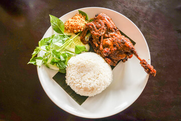 “Nasi Ayam Bakar” is a Javanese food made from grilled chicken with rice.