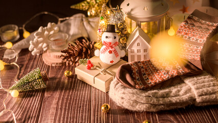 Christmas and Winter decorations on wooden table with decorative lights , Christmas background