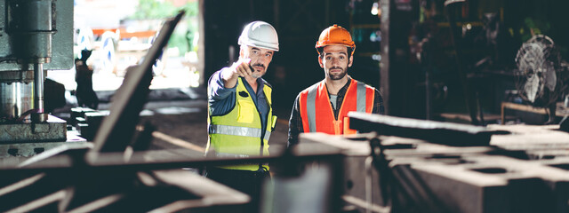 professional technician engineer working to check safety system of heavy industry manufacturing...