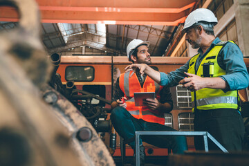 industrial factory with men at work concept, professional engineer foreman inspector talking in business occupation job teamwork with team, construction manager working in manufacturing technology job - obrazy, fototapety, plakaty