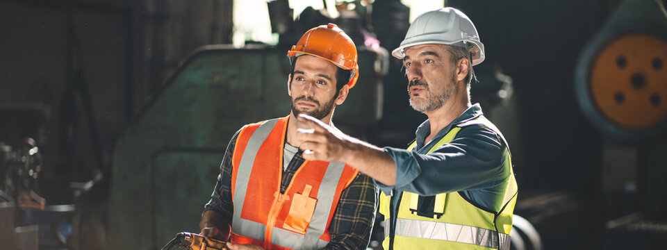 industrial factory with men at work concept, professional engineer foreman inspector talking in business occupation job teamwork with team, construction manager working in manufacturing technology job