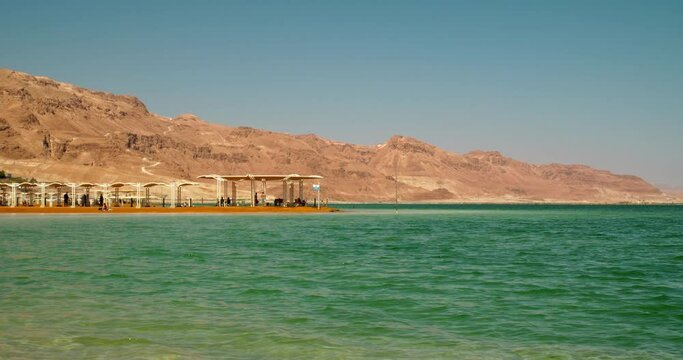 Beach on the Dead Sea in Israel. Mount Sodom is in the background.