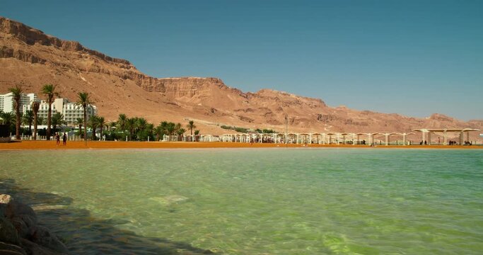 Shore of the Dead Sea in Israel. Hotel, beach and Mount Sodom. Ein Bokek Beach.