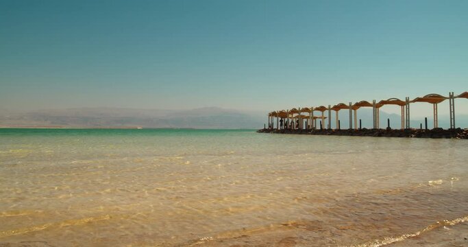 Rest on the shores of the Dead Sea. The bottom is covered with salt.
